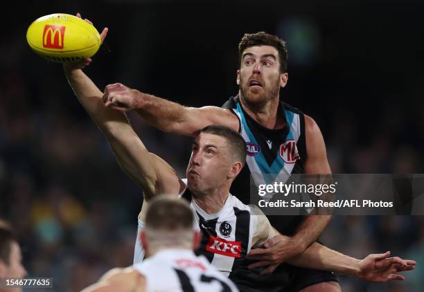 Scott Lycett of the Power and Darcy Cameron of the Magpies during the 2023 AFL Round 19 match between the Port Adelaide Power and the Collingwood...