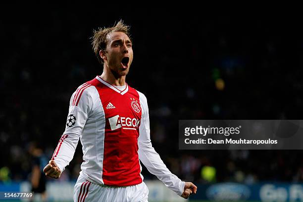 Christian Eriksen of Ajax celebrates after he shoots and scores his teams third goal of the game during the Group D UEFA Champions League match...