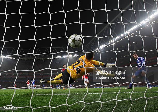 Ibrahim Afellay of Schalke 04 shoots past Vito Mannone of Arsenal to score their second goal during the UEFA Champions League Group B match between...