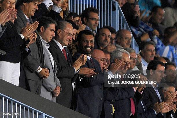 Malaga's Qatari president Sheikh Abdullah Al Thani smiles at the end of the UEFA Champions league football match Malaga CF vs AC Milan on October 24,...