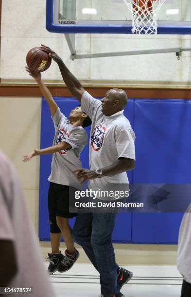 Legend Clyde Drexler participates in a youth clinic during NBA Canada Series 2012 on October 23, 2012 at the Magnus Eliason Recreation Centre in...