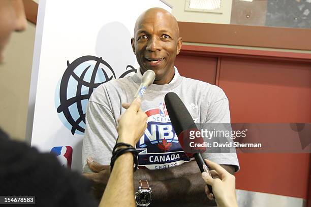 Legend Clyde Drexler answer questions from the media following the dedication of a refurbished basketball court and a youth clinic during NBA Canada...