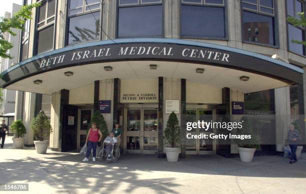 People walk by Beth Israel Medical Center May 30, 2002 in New York City.