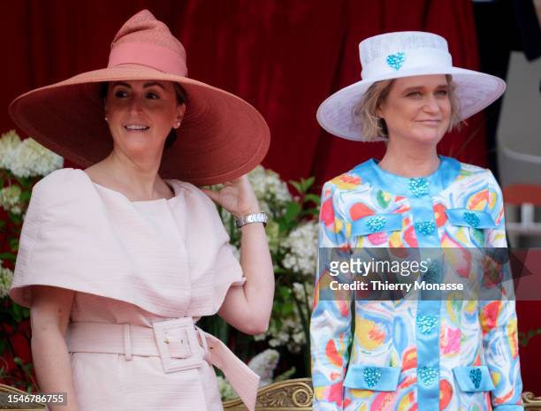 Princess Claire of Belgium is talking with the Princess Delphine of Belgium during the parade for the Belgium National Day on July 21 in Brussels,...