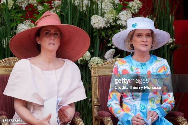Princess Claire of Belgium is talking with the Princess Delphine of Belgium during the parade for the Belgium National Day on July 21 in Brussels,...