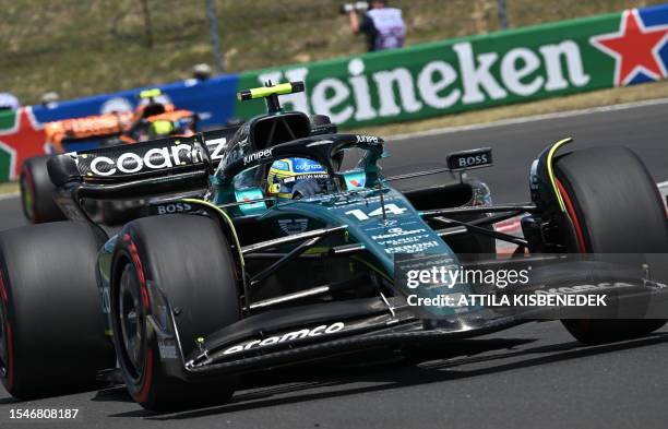 Aston Martin's Spanish driver Fernando Alonso drives during the third practice session at the Hungaroring race track in Mogyorod near Budapest on...