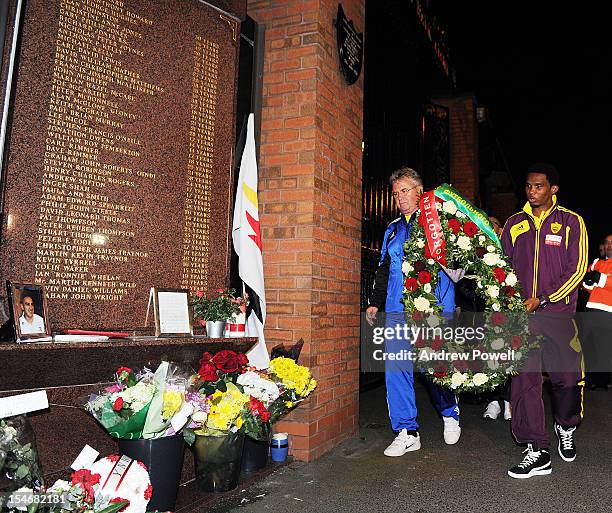 Manager Guus Hiddink of Anzhi Makhachkala and captain Samuel Eto'o lay a wreath in memory of the victims of the Hillsborough disaster at the...