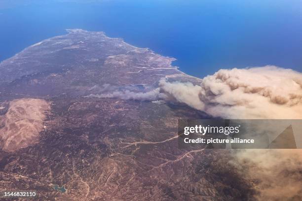 July 2023, Greece, Rhodos: Forest fires rage on the vacation island of Rhodes . According to meteorologists, the heat wave will continue next week...