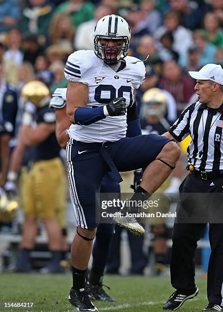 Bronson Kaufusi of the BYU Cougars celebrates a defensive play against the Notre Dame Fighting Irish at Notre Dame Stadium on October 20, 2012 in...