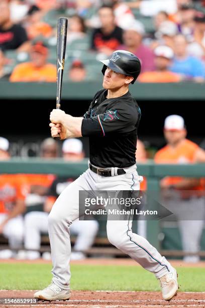 Joey Wendle of the Miami Marlins singles in a run in the first inning during a baseball game against the Baltimore Orioles at Oriole Park at Camden...