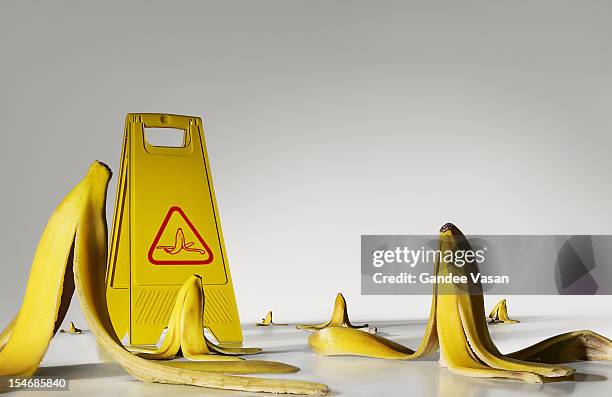 banana peels on the floor - banana peel stock pictures, royalty-free photos & images