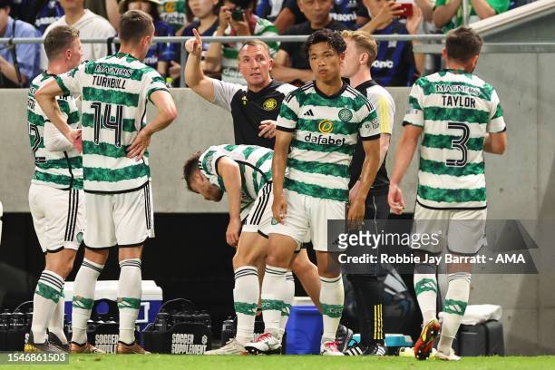 Brendan Rodgers the head coach / manager of Celtic instructs his players during a water break during the preseason friendly between Celtic and Gamba...