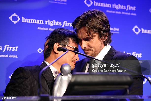 Activist Chen Guangcheng and Christian Bale attend the 2012 Human Rights First Awards at Pier Sixty at Chelsea Piers on October 24, 2012 in New York...