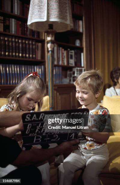 Madrid, July 1971, In the palace of the Zarzuela, the Infanta Elena and Prince FELIPE, both dressed identically, play with a clap of cinema .