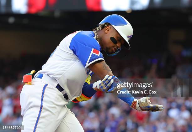 Ronald Acuna Jr. #13 of the Atlanta Braves reacts as he rounds third base after hitting a two-run homer in the third inning against the Chicago White...