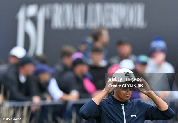 Golfer Rickie Fowler reacts on the 18th hole on day three of the 151st British Open Golf Championship at Royal Liverpool Golf Course in Hoylake,...