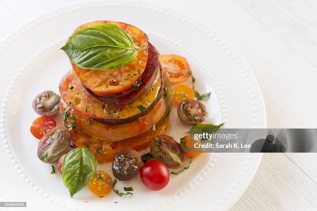 Heirloom tomato salad with basil garnish