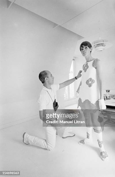 In Paris, in August 1967, Andre COURREGES preparing the parade of his creations called 'stitch-future' inspired by kinetic art: in his secret...