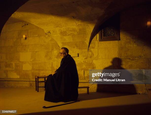 December 1985: Abbe Pierre staying at the Benedictine Abbey of St. Wandrille near Caudebec-en-Caux: the Abbe profile, praying or meditating in a room...