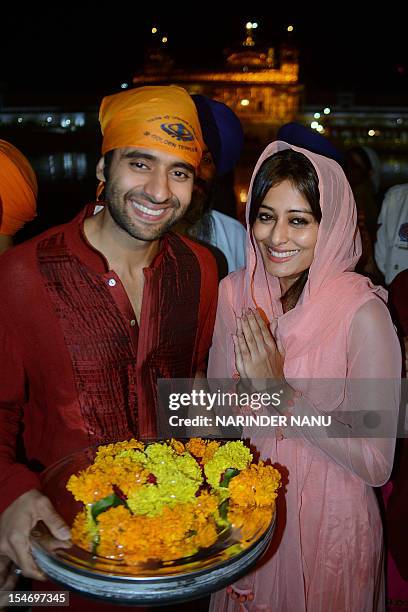 Indian film actor Jackky Bhagnani and actress Nidhi Subbaiah at the Sikh Shrine Golden Temple in Amritsar on October 24, 2012. The actors are...