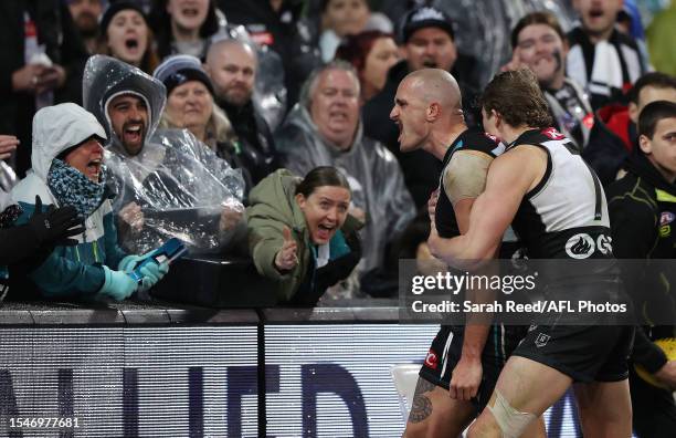 Sam Powell-Pepper of the Power celebrates a goal with Xavier Duursma of the Power during the 2023 AFL Round 19 match between the Port Adelaide Power...