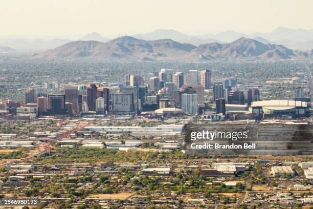 In an aerial view, the downtown skyline is seen during a heat wave on July 15, 2023 in Phoenix, Arizona. Weather forecasts today are expecting...