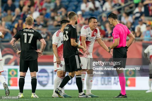 Bobby Wood of New England Revolution objects to yellow card from Referee Ismir Pekmic during a game between D.C.United and New England Revolution at...