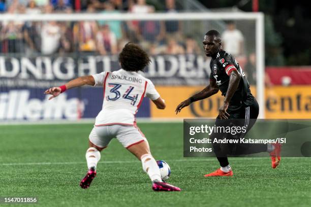 Christian Benteke of D.C.United brings the ball forward during a game between D.C.United and New England Revolution at Gillette Stadium on July 15,...