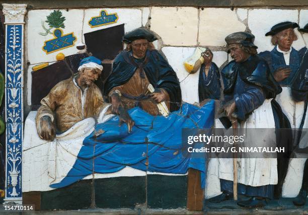 Visit the infirm, scene from Seven Works of Mercy, 1525-1528, by Santi Buglioni , glazed terracotta frieze, Ceppo Hospital, Pistoia, Tuscany. Detail....