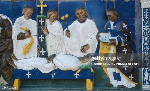 Bury the dead, scene from Seven Works of Mercy, 1525-1528, by Santi Buglioni , glazed terracotta frieze, Ceppo Hospital, Pistoia, Tuscany. Detail....