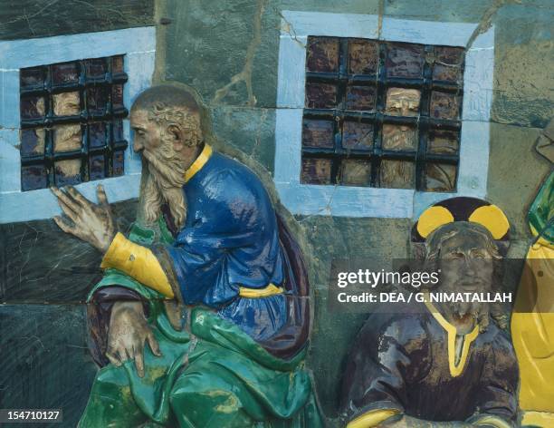 Visit the Imprisoned, scene from Seven Works of Mercy, 1525-1528, by Santi Buglioni , glazed terracotta frieze, Ceppo Hospital, Pistoia, Tuscany....