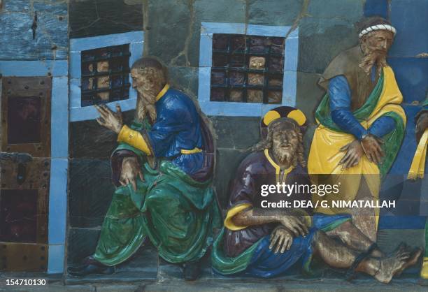 Visit the Imprisoned, scene from Seven Works of Mercy, 1525-1528, by Santi Buglioni , glazed terracotta frieze, Ceppo Hospital, Pistoia, Tuscany....