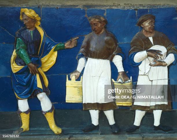 Visit the Imprisoned, scene from Seven Works of Mercy, 1525-1528, by Santi Buglioni , glazed terracotta frieze, Ceppo Hospital, Pistoia, Tuscany....