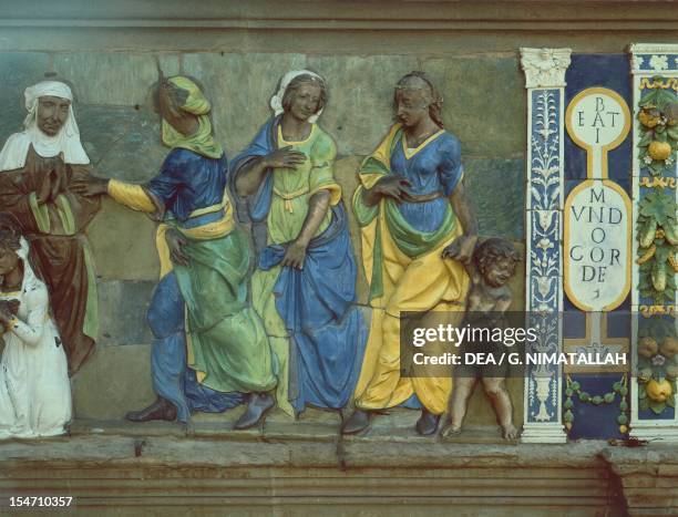 Clothe the naked and provide for widows and orphans, scene from the Seven Works of Mercy by Santi Buglioni , glazed terracotta frieze, Ceppo...