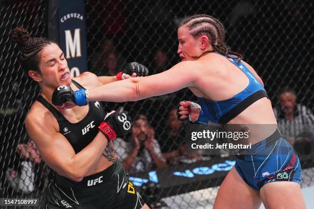 Chelsea Chandler punches Norma Dumont of Brazil in their featherweight fight during the UFC Fight Night at UFC APEX on July 15, 2023 in Las Vegas,...