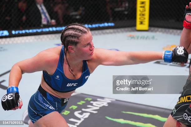 Chelsea Chandler punches Norma Dumont of Brazil in their featherweight fight during the UFC Fight Night at UFC APEX on July 15, 2023 in Las Vegas,...