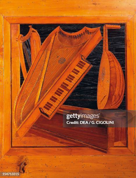 Wooden inlays depicting musical instruments. Isabella d'Este's music room, Ducal Palace, Mantua. Italy, 13th-16th century.