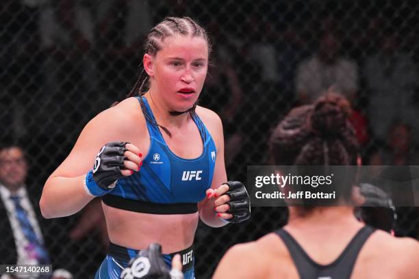 Chelsea Chandler battles Norma Dumont of Brazil in their featherweight fight during the UFC Fight Night at UFC APEX on July 15, 2023 in Las Vegas,...