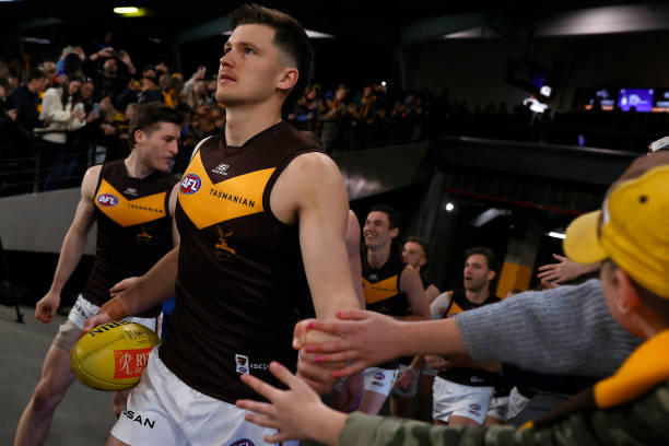 Hawthorn players run out before the round 18 AFL match between North Melbourne Kangaroos and Hawthorn Hawks at Marvel Stadium, on July 16 in...