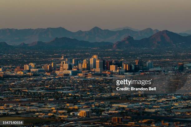In an aerial view, the downtown skyline is seen during a heat wave on July 15, 2023 in Phoenix, Arizona. Weather forecasts today are expecting...