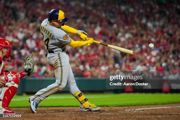 William Contreras of the Milwaukee Brewers singles in the eighth inning against the Cincinnati Reds at Great American Ball Park on July 15, 2023 in...
