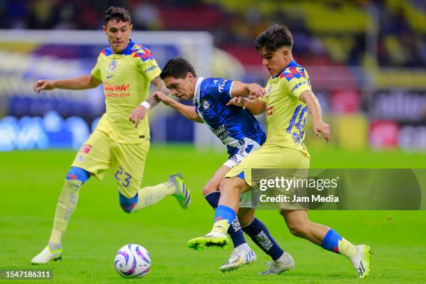 Carlos Baltazar of Puebla fights for the ball with Bruce El-mesmari of America during the 3rd round match between America and Puebla as part of the...
