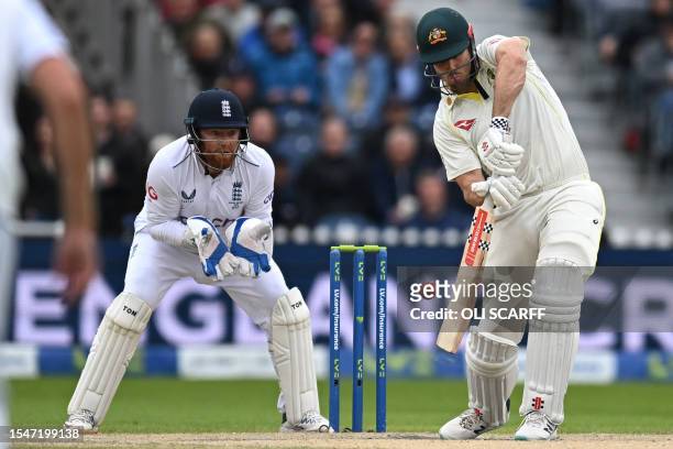 Australia's Mitchell Marsh plays a shot as England's Jonny Bairstow keeps wicket on day four of the fourth Ashes cricket Test match between England...