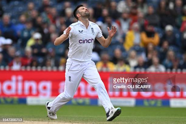 England's Mark Wood reacts while bowling on day four of the fourth Ashes cricket Test match between England and Australia at Old Trafford cricket...