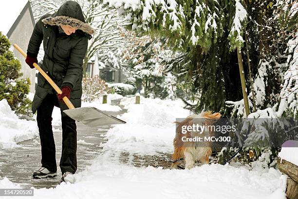 winter-spaß - snow shovel stock-fotos und bilder