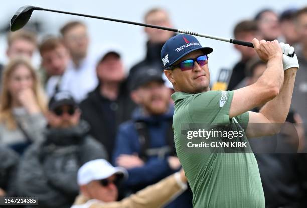 Golfer Zach Johnson watches his drive from the 15th tee on day three of the 151st British Open Golf Championship at Royal Liverpool Golf Course in...