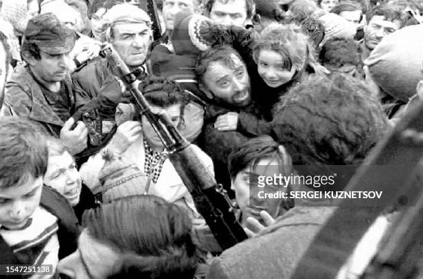 Group of Abkhazians, mostly of Russian, Georgian, Armenian and Jewish origin, storm the airport of Sukhumi, Georgia 09 October, 1992 to board guarded...
