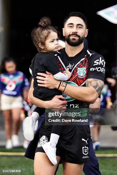 Shaun Johnson of the Warriors with daughter Millah runs out for the round 20 NRL match between the New Zealand Warriors and the Cronulla Sharks at Mt...