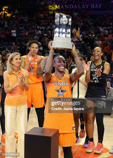 Jewell Loyd of Team Stewart lifts the trophy after being named the MVP of the 2023 WNBA All-Star game at Michelob ULTRA Arena on July 15, 2023 in Las...