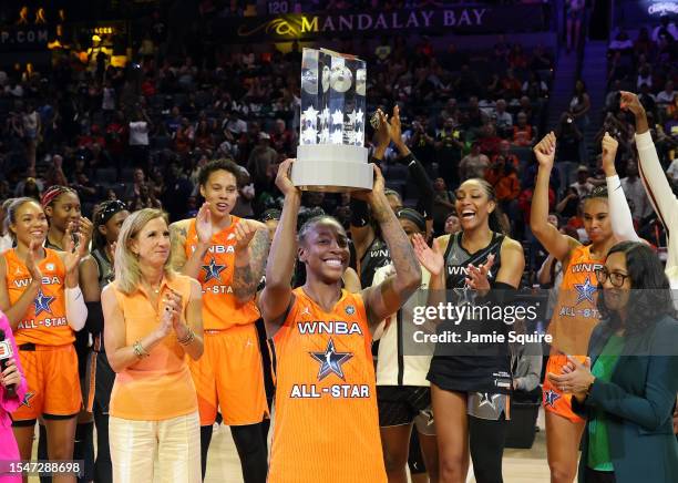 Jewell Loyd of Team Stewart lifts the trophy after being named MVP of the 2023 WNBA All-Star game at Michelob ULTRA Arena on July 15, 2023 in Las...